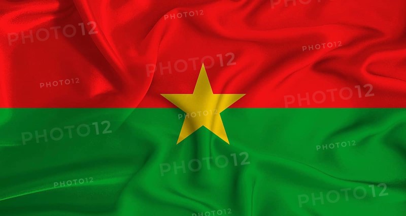 Realistic Burkina Faso flag waving. Close up of flag of Burkina Faso with cloth texture