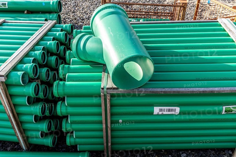 Symbolic picture construction site, sewage pipes for dirty and rainwater, for installation in the ground, plastic pipes, made of polypropylene, storage on a construction site