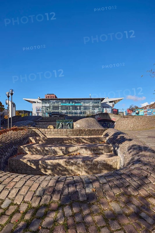 Wunderino Arena multi-purpose hall or former Baltic Sea Hall, pedestrian zone, square, fountain, building material brick, cobblestones and paving stones, lantern, paving stone and cobblestone walkway, bare winter trees, blue sky, splash, Europaplatz, Kiel, state capital, district-free city, Schleswig-Holstein, Germany