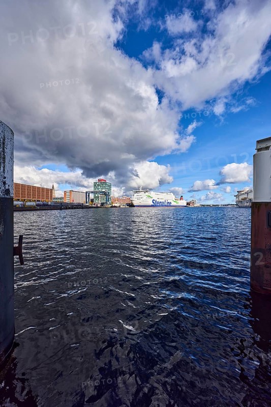 Kiel Fjord, harbour, duckdalben, ferry, seaport Kiel GmbH and Co. KG, quay, portal crane, general architecture, lake port Kiel GmbH and Co. KG, water surface with small waves, blue sky, cumulus clouds, stratocumulus clouds, white and dark clouds, Kiel, state capital, district-free city, Schleswig-Holstein, Germany