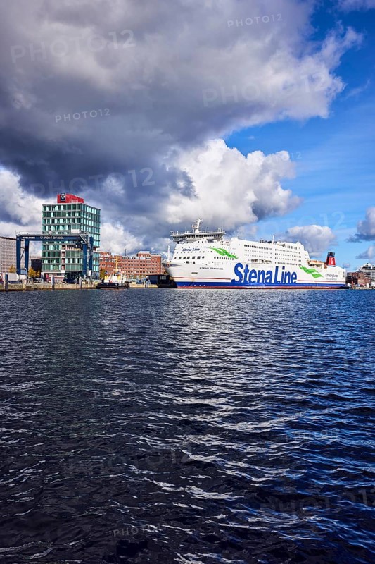 Kiel Fjord, Stena Germanica ferry, Stena Line GmbH, ferry, port house, high-rise building, modern architecture, general development, port, wharf, portal crane, seaport Kiel GmbH and Co. KG, water surface with small waves, blue sky, cumulus clouds, stratocumulus clouds, white and dark clouds, Kiel, state capital, district-free city, Schleswig-Holstein, Germany