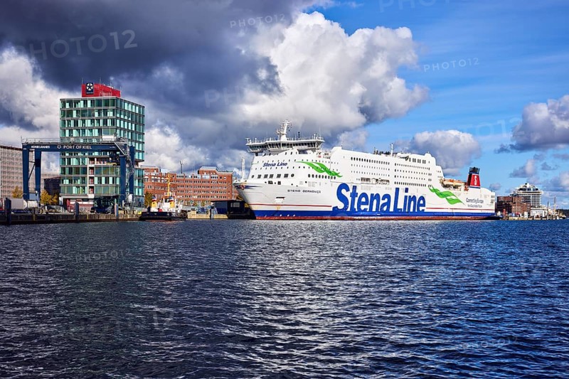 Kiel Fjord, Stena Germanica ferry, Stena Line GmbH, ferry, port house, high-rise building, modern architecture, general development, port, wharf, portal crane, seaport Kiel GmbH and Co. KG, water surface with small waves, blue sky, cumulus clouds, stratocumulus clouds, white and dark clouds, Kiel, state capital, district-free city, Schleswig-Holstein, Germany