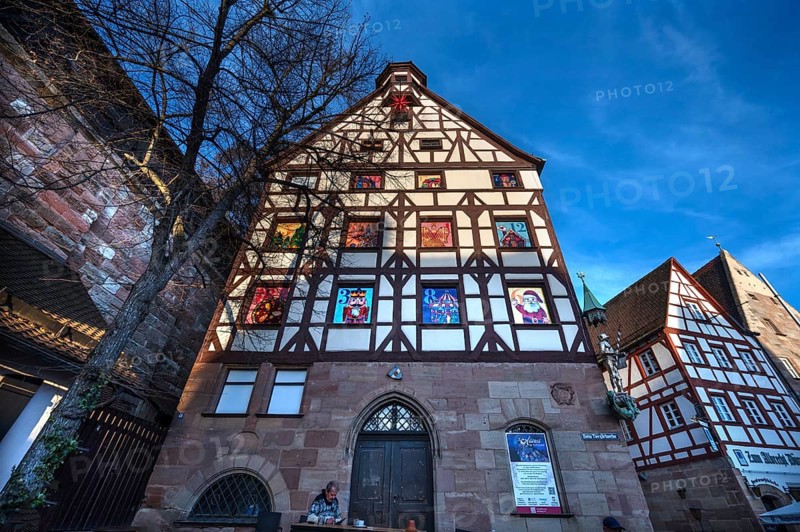 Historic Pilate House with the annual advent calendar in the evening sun, Tiergärtnertor, Nuremberg, Middle Franconia, Bavaria, Germany