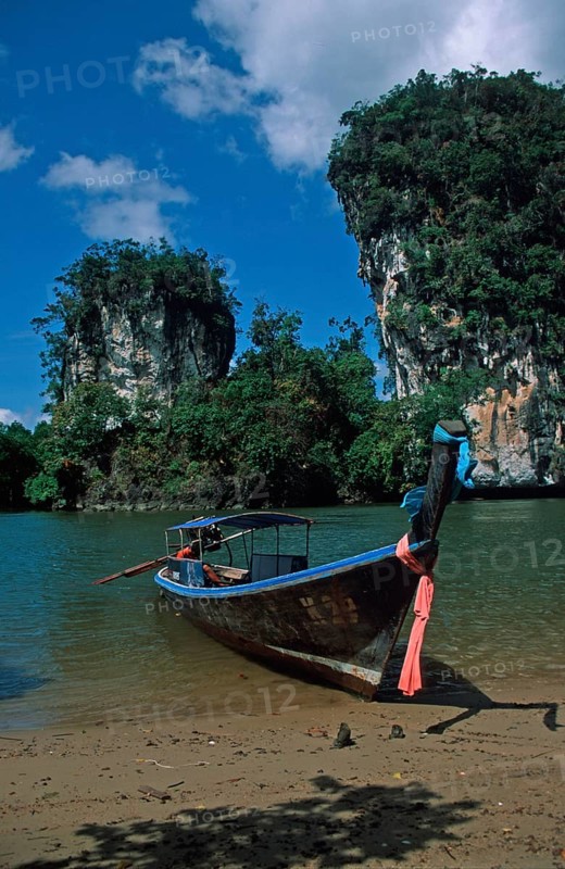 Longtail boat on the banks of the tidal river near Krabbi, two years in front of the tsunami, Thailand, December 2002, vintage, retro, old, historic