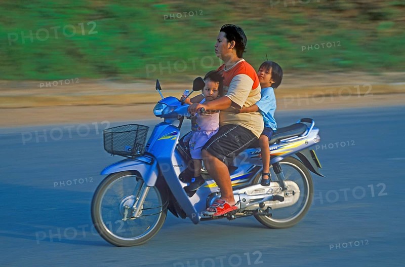 Father with his two children on a moped, Krabi, Thailand, December 2002, vintage, retro, old, historic