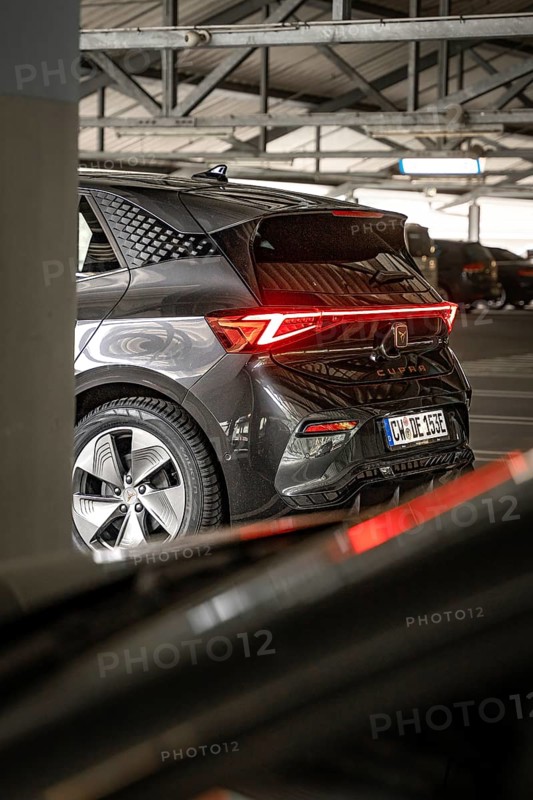 Rear view of a modern black car with distinctive LED rear lights in garage, Cupra electric car, e-car sharing, Calw, Germany