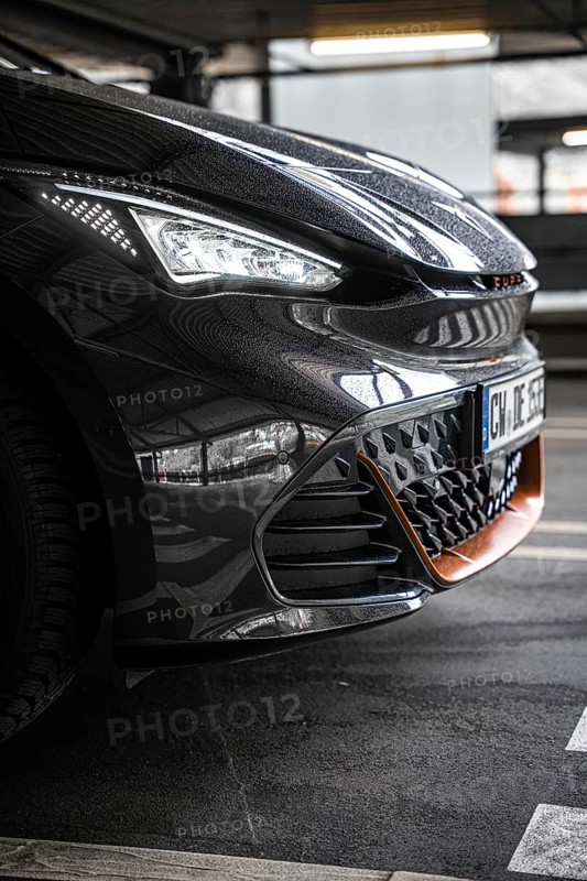 Close-up of a modern black car in underground garage with sporty design, Cupra electric car, e-car sharing, Calw, Germany