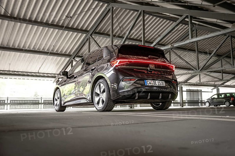Modern black car in an urban parking garage from the rear view, Cupra electric car, e-car sharing, Calw, Germany