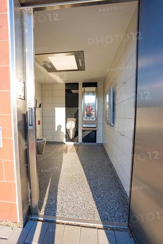 Modern bathroom with tiled floor and wall mirror, Weil der Stadt railway station, Germany
