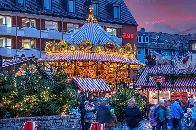 Nostalgic children's carousel at the children's Christmas market in the evening, Hans Sachs Platz, Nuremberg, Middle Franconia, Bavaria, Germany