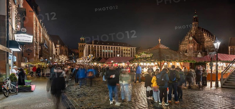 Christmas market illuminated in the evening with Frauekirche and town hall, Hauptmarkt, Nuremberg Middle Franconia, Bavaria, Germany