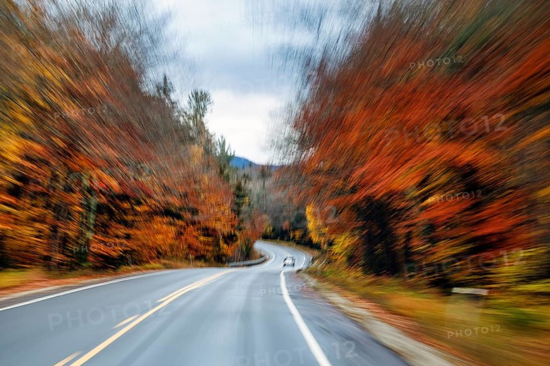 Car, rain-wet road, curvy country road, autumn leaves, Indian summer, smudge effect, blur, Kancamagus Highway, White Mountain, New Hampshire, New England, USA