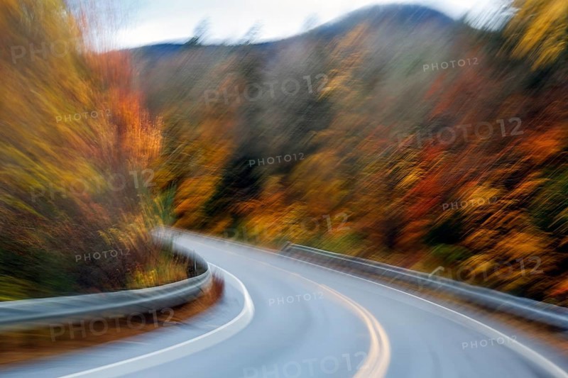 Curvy country road, autumn leaves, Indian summer, smudge effect, blur, Kancamagus Highway, White Mountain, New Hampshire, New England, USA