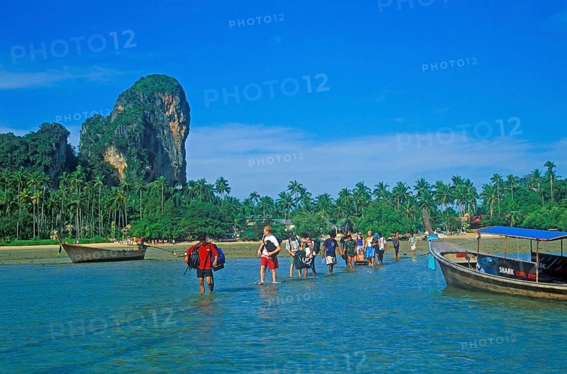 Tourists wade to their boat taxi that brings them back to Krabi, two years in front of the tsunami, Railay East, Krabi, Thailand, December 2002, vintage, retro, old, historic