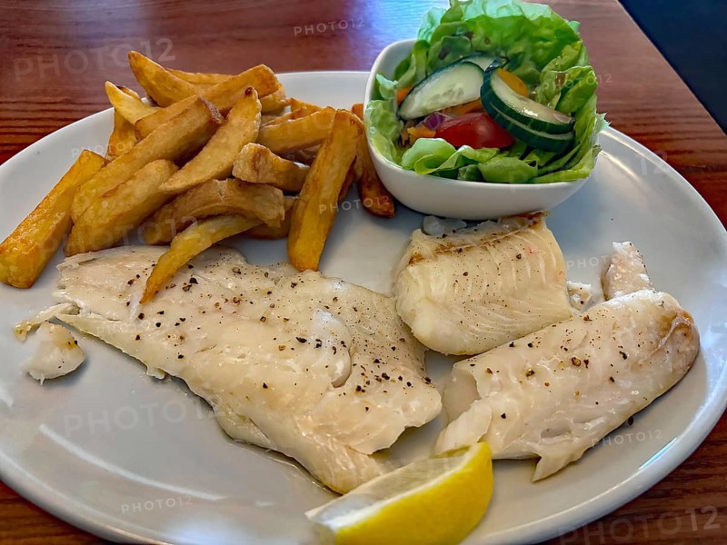 Dish with fried fish, fries and fresh salad on a plate, fish and chips, national dish, Scotland, Great Britain