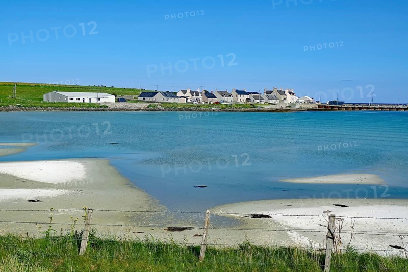 Small village on a peaceful coast with blue water and clear skies, Pierowall, Orkney Islands, Ornkeys, Scotland, Great Britain