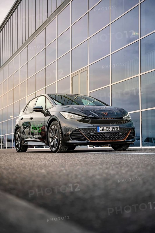 Car in front of a large glass façade of a modern office building, Deer E-Car Sharing, Cupra electric car, Böblingen, Germany