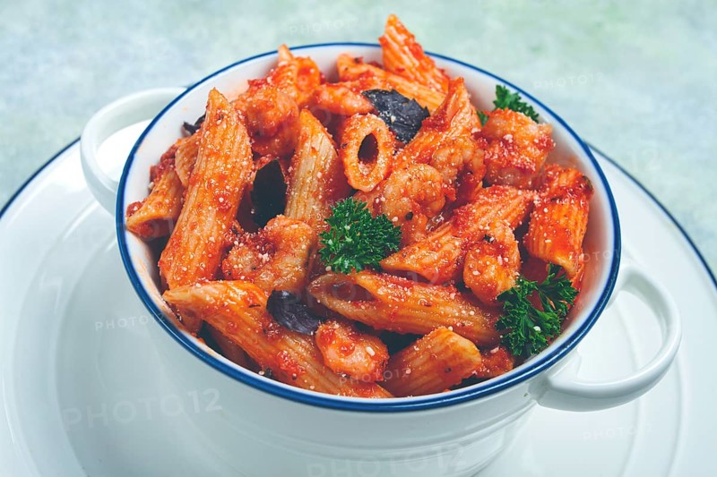 Penne pasta, with shrimp in tomato sauce, close-up, no people