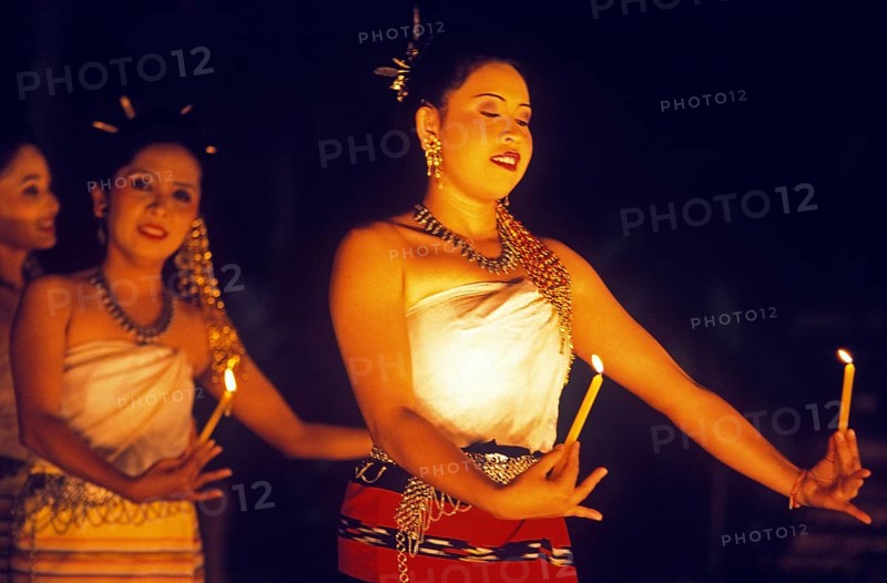 Young woman perform a traditional candle dance, Ko Phuket, Thailand, December 2002, vintage, retro, old, historic