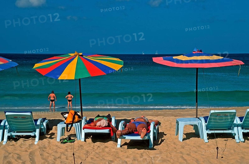 People, umbrellas and sun loungers at Karon Beach, two years in front of the tsunami, Ko Phuket, Thailand, December 2002, vintage, retro, old, historic