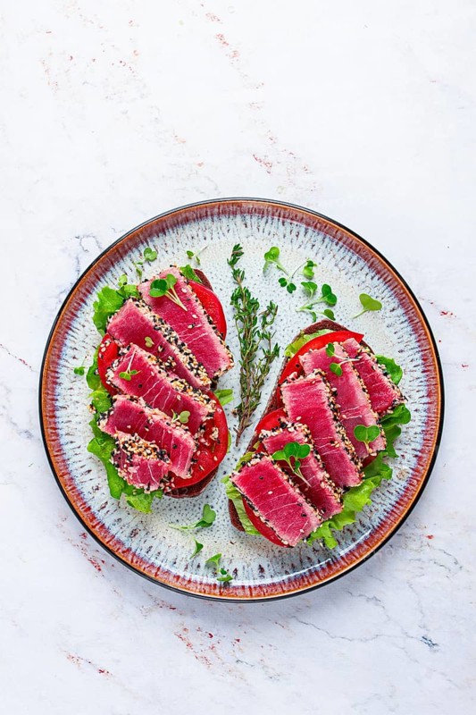 Sandwiches with fried tuna fillet in sesame seeds, breakfast, top view, homemade