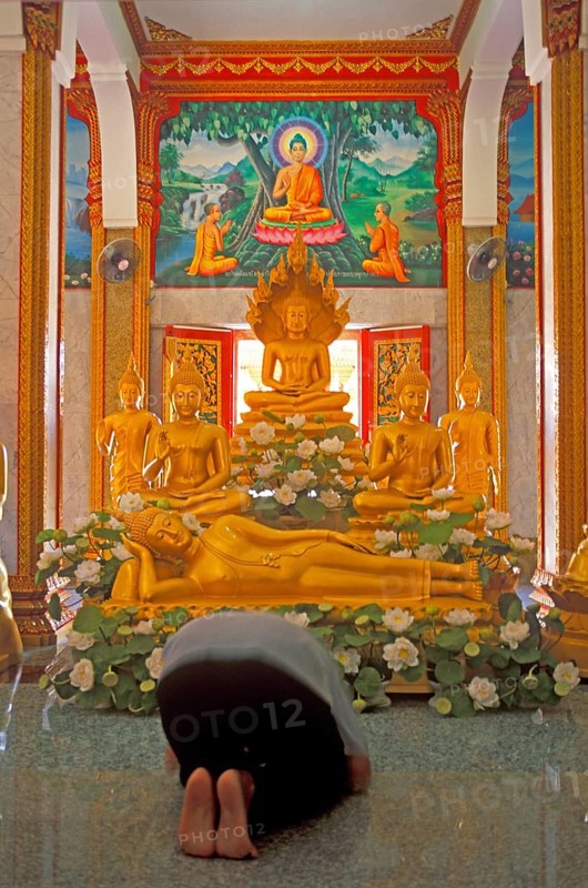 Believer praying, Wat Chalong monastery, Ko Phuket, Thailand, December 2002, vintage, retro, old, historic
