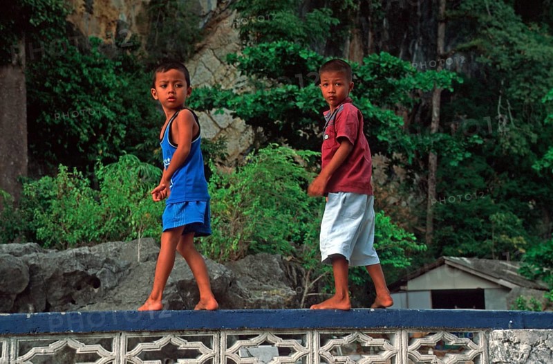 Little boys, children in the stilt village of Ko Pannyi in Phangnga Bay near Ko Phuket, two years in front of the tsunami, Thailand, December 2002, vintage, retro, old, historic