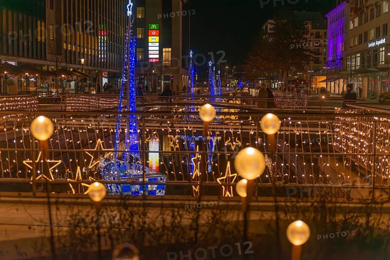 Christmas decoration in Kiel am Holstenfleet, Kleiner Kiel Canal, city center, Christmas, lighting, lights, sailboats, stars, water reflection, shops, bridge, evening, darkness, Germany