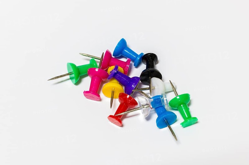 Colorful drawing pins with metal tips on white background, Germany
