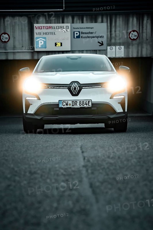 SUV with headlights switched on in front of a parking garage, front view, Deer e-Carsharing, Renault Megane, Calw, Germany