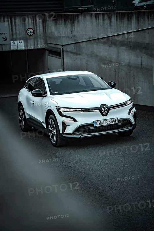 White modern SUV drives out of an underground car park on asphalt ground, Deer E-Carsharing, Renault Megane, Calw, Germany