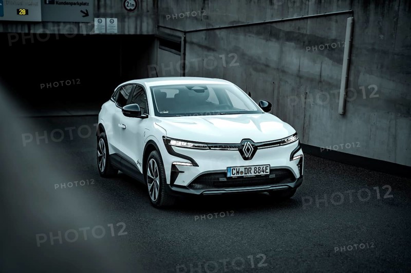 White modern SUV drives out of an underground car park on asphalt ground, Deer E-Carsharing, Renault Megane, Calw, Germany
