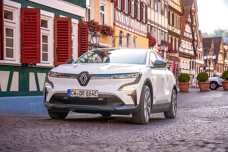 White car in picturesque old town with half-timbered houses and floral decorations, Deer e-Carsharing, Renault Megane, Calw, Germany