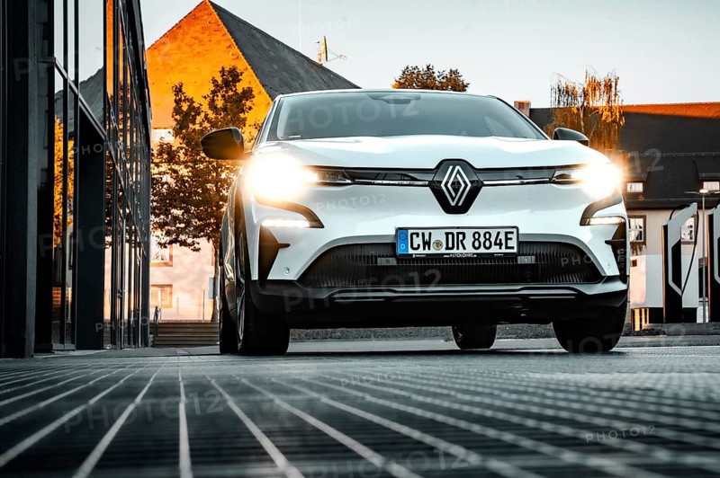 Renault car with headlights on in an evening cityscape, Deer e-car sharing, Renault Megane, Calw, Germany