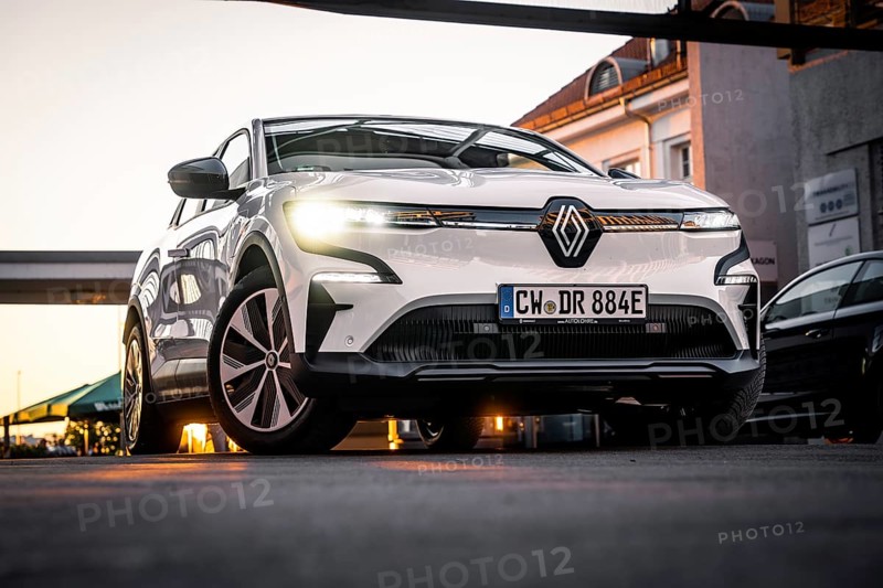 Low angle view of a car on an urban road in front of modern architecture, Deer E-Carsharing, Renault Megane, Calw, Germany