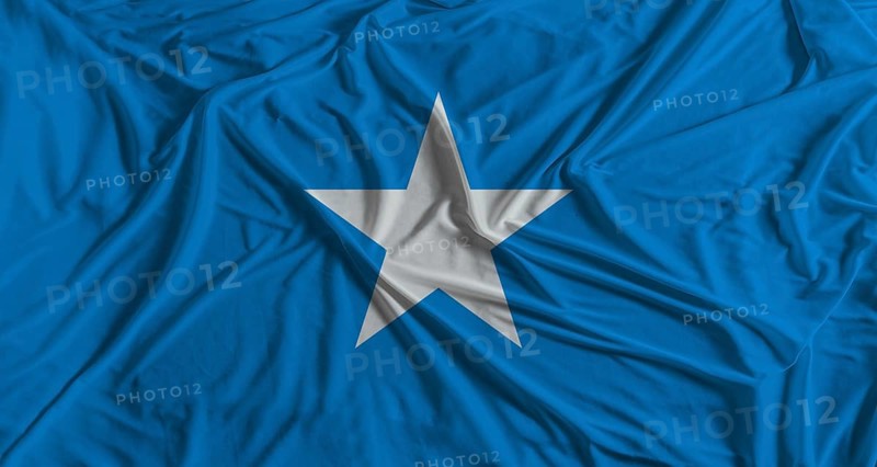 Somalia flag with fabric texture background. National flag of Somalia with cloth texture