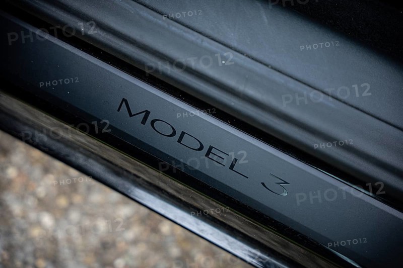 Close-up of Model 3 lettering on black metal, Deer E-Carsharing, Tesla Model 3, Calw, Germany