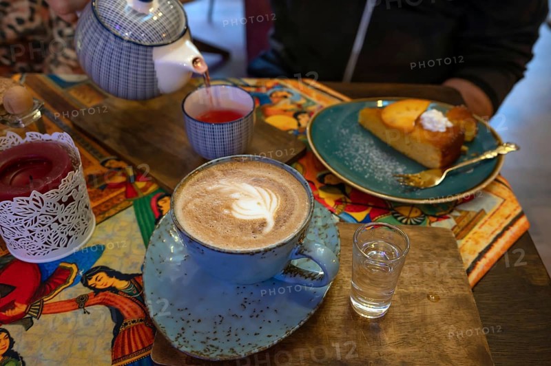 Cappuccino, tea and cake served in a Persian café, Fürth, Mittelfranken, Bayern, Germany
