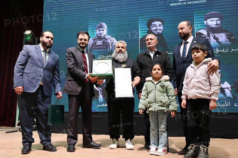 DAMASCUS, SYRIA, DECEMBER 6, 2025: Ministers and high-ranking officials of the newly formed Syrian government attend a symbolic ceremony to honor the families of victims who lost their lives during the Syrian war. The event, held in the capital Damascus, aims to provide social and symbolic recognition to the relatives of those fallen during the conflict as part of the country's transitional or commemorative phase, Damascus, Damascus, Syria