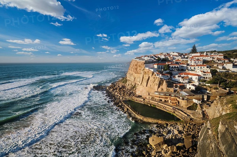 Charming seaside village of Azenhas do Mar perched on cliffs above the Atlantic Ocean. Enjoy stunning views, unique architecture, and the beauty of nature along the coast