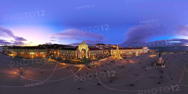 360 degrees aerial panorama of winter twilight at Praca do Comercio in Lisbon, featuring a stunning Christmas tree and festive lights