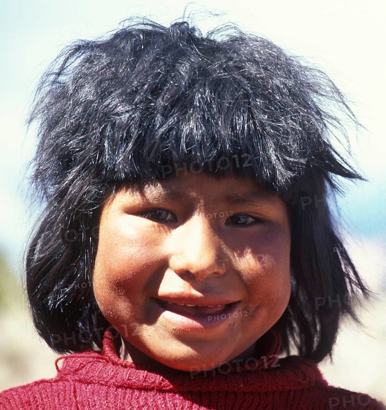 Portrait of a cheerful little girl on Isla Taquile in Lake Titicaca, Andean Highlands, Peru, South America, September 1997, vintage, retro, old, historical