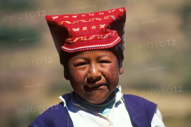 Little boy wearing traditional clothes on Isla Taquile in Lake Titicaca, Andean Highlands, Peru, South America, September 1997, vintage, retro, old, historic