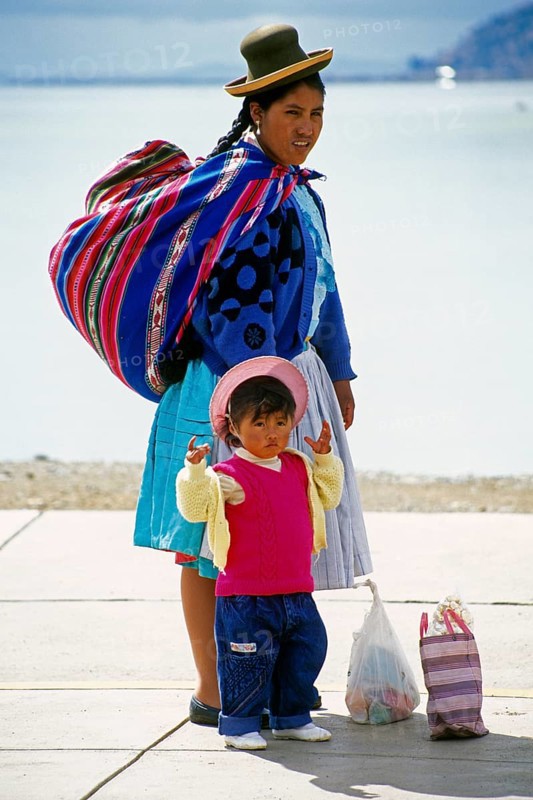 Traditionally dressed young woman with young daughter at Lake Titicaca in Puno, Andean Highlands, Peru, South America, September 1997, vintage, retro, old, historic