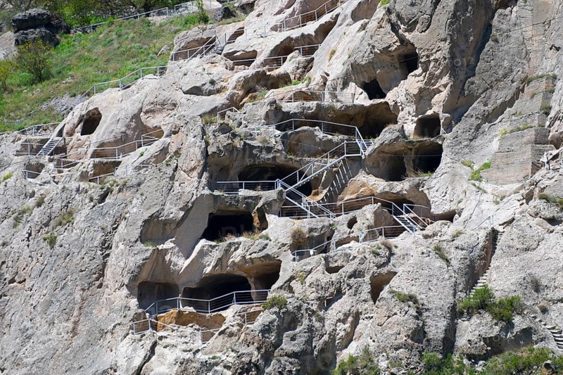 Nested monastery in rocks with caves and balustrades. Historical stone architecture, cave town, cave monastery, Vardzia, Vardzia, Samtskhe—Javakheti region, Samtske Javacheti, Lesser Caucasus, Georgia