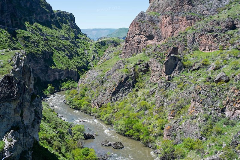 A river flows through a narrow green gorge with steep rocky slopes, Kura River, Gorge near Vardzia, Samtskhe—Javakheti Region, Samtske Javacheti, Lesser Caucasus, Georgia