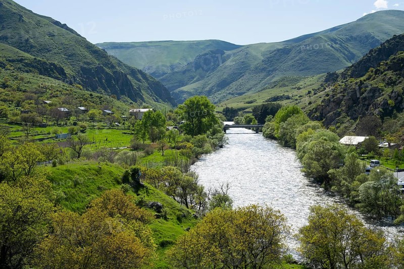 Idyllic valley with a flowing river. Hilly landscape with lush greenery, Kura river, landscape near Vardzia, Samtskhe—Javakheti region, Samtske Javacheti, Lesser Caucasus, Georgia