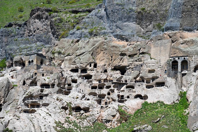 A rocky wall with numerous cave openings carved into the stone, cave town, cave monastery, Vardzia, Samtskhe—Javakheti region, Samtske Javacheti, Lesser Caucasus, Georgia