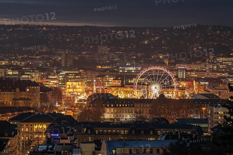 The view from above of the Stuttgart 2025 Christmas market with the Ferris wheel shows a sea of festive lights and bustling stands that capture the winter atmosphere of the city