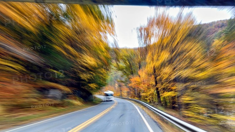 Motorhome, curvy country road, autumn leaves, Indian summer, traveling, symbolic photo, zoom effect, blur, panoramic Mohawk Trail road, former trade route, Massachusetts, New England, USA
